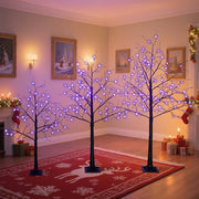 Halloween ghost trees with lights in a cozy living room, designed for spooky season décor.
